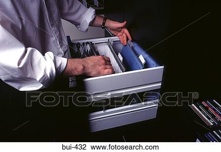 Man Looking Through Filing Cabinet View Large Photo Image Stock Image - Man Looking Through Filing Cabinet. Fotosearch