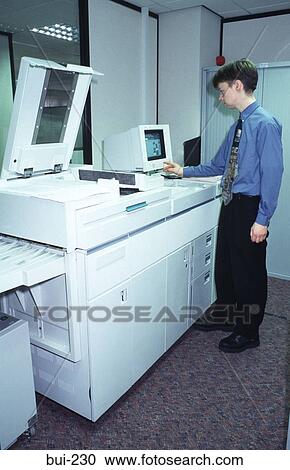 Man Operating Docuprint Machine UK View Large Photo Image Stock Image - Man Operating Docuprint Machine UK. Fotosearch
