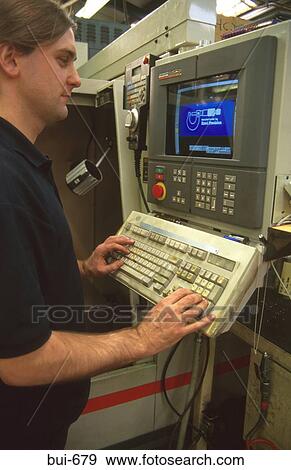 Man Operating Lathe Controls View Large Photo Image Stock Photo - Man Operating Lathe Controls. Fotosearch