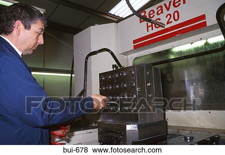 Man Operating Machine Controls in Factory View Large Photo Image Stock Photo - Man Operating Machine Controls in Factory. Fotosearch