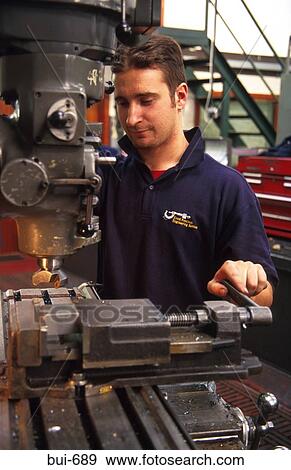 Man Operating Pillar Drill in Factory View Large Photo Image Stock Photo - Man Operating Pillar Drill in Factory. Fotosearch