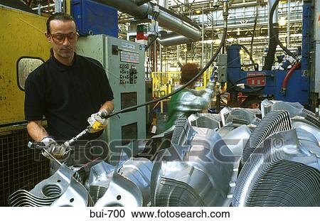 Man Standing By Pressed Metal Components View Large Photo Image Stock Image - Man Standing By Pressed Metal Components. Fotosearch