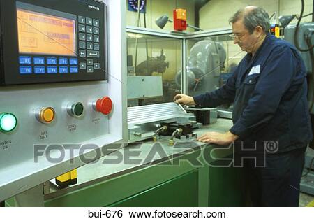 Man Using Computer Controlled Lathe in Factory View Large Photo Image Stock Photograph - Man Using Computer Controlled Lathe in Factory. Fotosearch