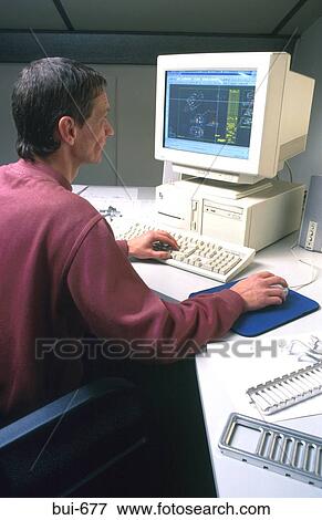 Man Using Computer Terminal View Large Photo Image Stock Photo - Man Using Computer Terminal. Fotosearch