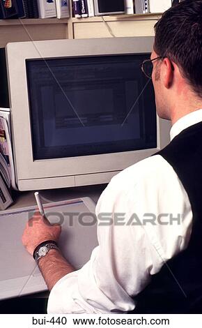 Stock Image - Man using Graphics Tablet with Computer. Fotosearch