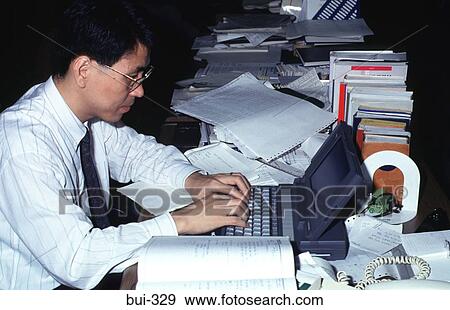Man Working on Lap Top Computer at Desk Korea View Large Photo Image Stock Photo - Man Working on Lap Top Computer at Desk Korea. Fotosearch