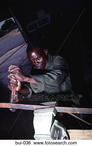 Mechanic Working Metal in a Vice Zimbabwe View Large Photo Image Stock Photograph - Mechanic Working Metal in a Vice Zimbabwe. Fotosearch