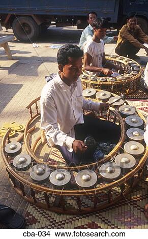 Men Playing Large Gong Circles Cambodia View Large Photo Image Picture - Men Playing Large Gong Circles Cambodia. Fotosearch