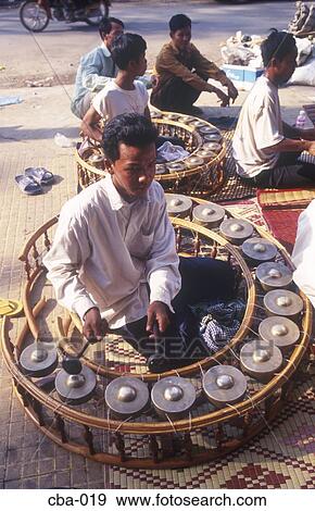 Men Playing Large Gong Circles Cambodia View Large Photo Image Stock Photo - Men Playing Large Gong Circles Cambodia. Fotosearch