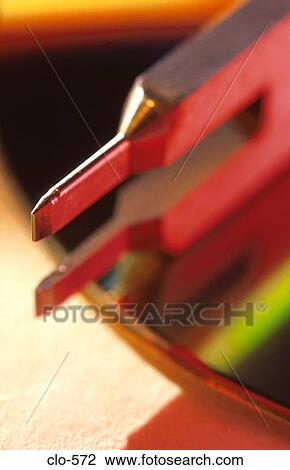 Metal Pronged Device on CD View Large Photo Image Stock Image - Metal Pronged Device on CD. Fotosearch