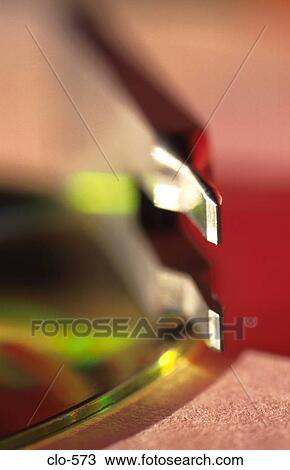 Metal Pronged Device on CD View Large Photo Image Stock Image - Metal Pronged Device on CD. Fotosearch