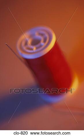 Stock Image - Needle and Cotton Reel. Fotosearch