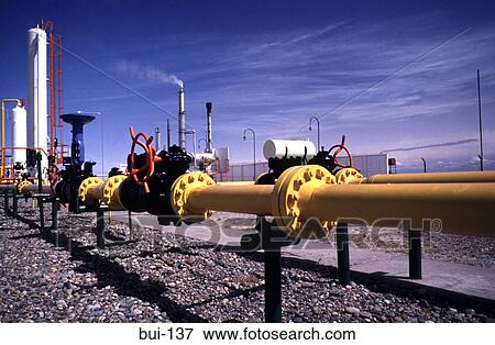Oil Refinery pipes at a Drilling Site View Large Photo Image Stock Photo - Oil Refinery pipes at a Drilling Site. Fotosearch