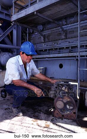 Oil Rig Worker Inspecting Machinery View Large Photo Image Stock Image - Oil Rig Worker Inspecting Machinery. Fotosearch