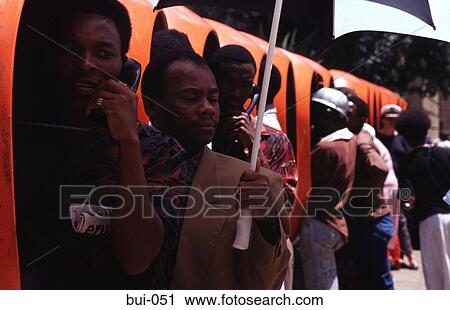 Stock Image - Orange Telephone Kiosks Johannesburg. Fotosearch
