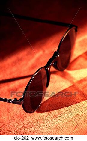Pair of Sunglasses on Desk View Large Photo Image Stock Image - Pair of Sunglasses on Desk. Fotosearch