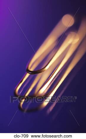 Paper Clip against Purple Background View Large Photo Image Stock Photo - Paper Clip against Purple Background. Fotosearch