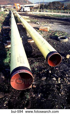 Plastic Pipes Awaiting Use Wales UK View Large Photo Image Picture - Plastic Pipes Awaiting Use Wales UK. Fotosearch