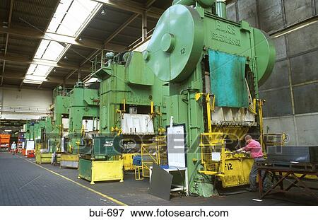 Row of Large Metal Presses in Factory Building View Large Photo Image Stock Photo - Row of Large Metal Presses in Factory Building. Fotosearch