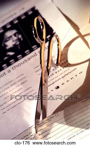 Stock Photograph - Scissors Cutting Out Form. Fotosearch