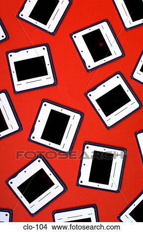 Slides Laid out on an Orange Background View Large Photo Image Picture - Slides Laid out on an Orange Background. Fotosearch