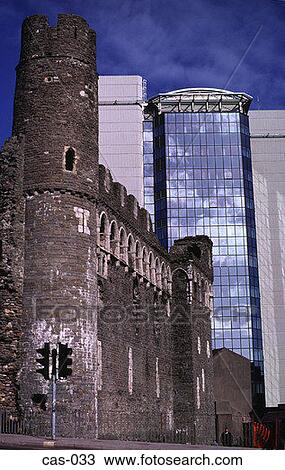 Stock Image - Swansea Castle in Front of Glass Office Block Wales. Fotosearch