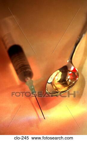 Stock Photography - Syringe and Spoon Containing Liquid. Fotosearch