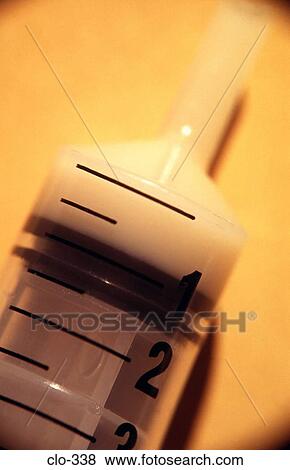 Syringe Containing White Fluid View Large Photo Image Stock Photo - Syringe Containing White Fluid. Fotosearch