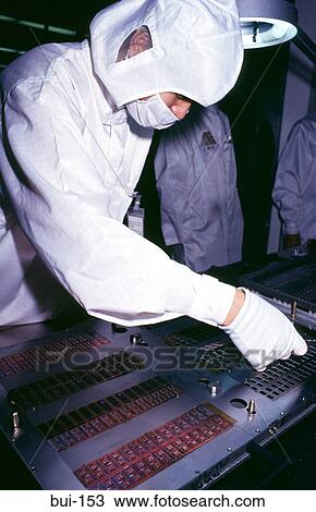 Stock Image - Technician at Silicon Computer Chip Production Line. Fotosearch