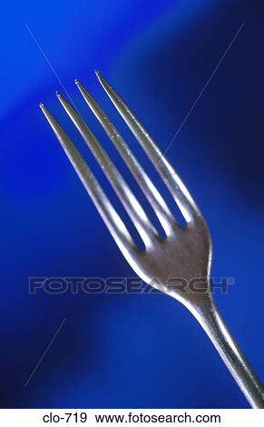 Tines of Fork against Blue Background View Large Photo Image Stock Photo - Tines of Fork against Blue Background. Fotosearch