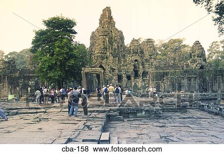 Tourists at the Bayon Angkor Thom Siem Reap Cambodia View Large Photo Image Stock Photo - Tourists at the Bayon Angkor Thom Siem Reap Cambodia. Fotosearch