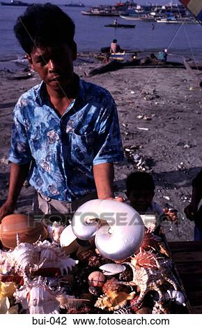Stock Image - Trader Selling Shells Philippines. Fotosearch