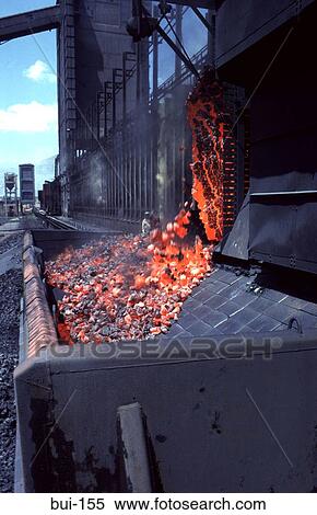Stock Photography - Train Waggon Filled with Molten Coke from Oven. Fotosearch