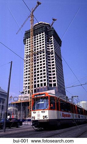 Tram in front of construction site View Large Photo Image Stock Image - Tram in front of construction site. Fotosearch