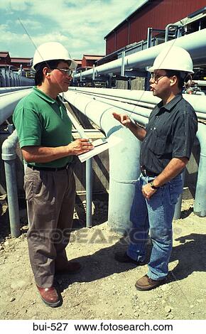 Two Engineers outside Oil Refinery Colombia View Large Photo Image Stock Photo - Two Engineers outside Oil Refinery Colombia. Fotosearch