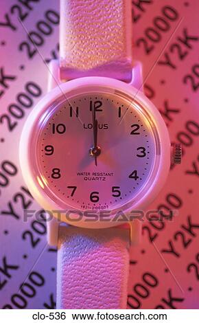 Stock Photograph - Watch with 2000 and Y2K in Background. Fotosearch