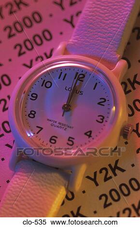 Stock Photography - Watch with 2000 and Y2K in Background. Fotosearch