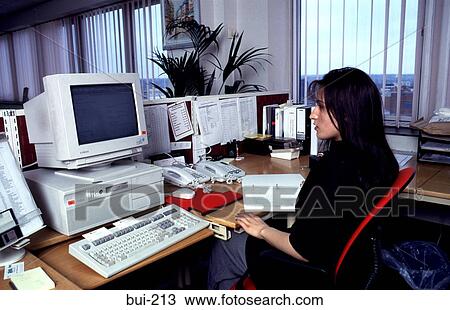 Woman Working at Desk in Office England UK View Large Photo Image Stock Image - Woman Working at Desk in Office England UK. Fotosearch