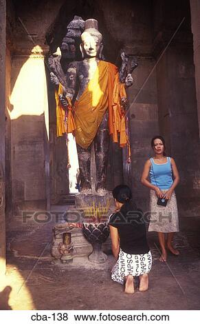 Women at Shrine to Vishnu Angkor Wat Cambodia View Large Photo Image Stock Photo - Women at Shrine to Vishnu Angkor Wat Cambodia. Fotosearch