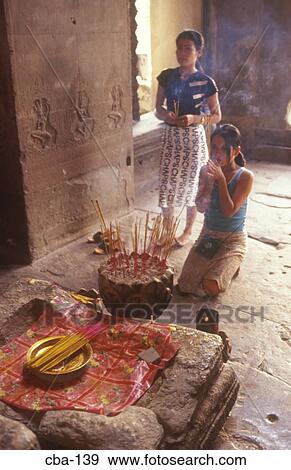 Stock Photo - Women at Shrine to Vishnu Angkor Wat Cambodia. Fotosearch