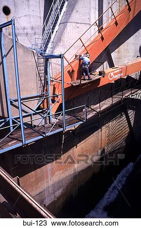 Worker at Wall Face on Steel Arm Dam Construction View Large Photo Image Stock Image - Worker at Wall Face on Steel Arm Dam Construction. Fotosearch
