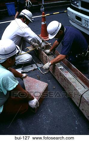 Stock Photo - Workers Tying Steel Lintel. Fotosearch