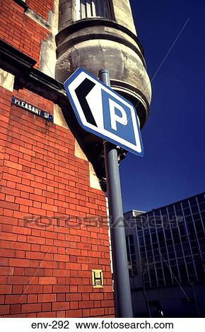 Arrow Pointing to Car Park by Brick Building View Large Photo Image Stock Image - Arrow Pointing to Car Park by Brick Building. Fotosearch