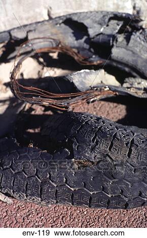 Badly Damaged Tyre left as Rubbish View Large Photo Image Stock Photo - Badly Damaged Tyre left as Rubbish. Fotosearch