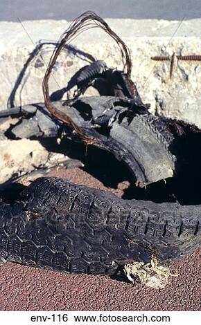 Badly Damaged Tyre left as Rubbish View Large Photo Image Stock Photograph - Badly Damaged Tyre left as Rubbish. Fotosearch