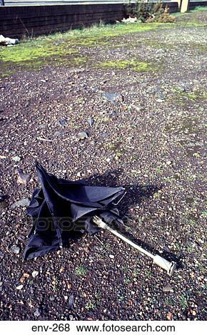 Broken Black Umbrella on Ground View Large Photo Image Stock Photo - Broken Black Umbrella on Ground. Fotosearch