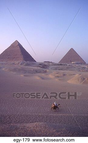 Camel Riders Passing Great Pyramid Giza Egypt View Large Photo Image Stock Photo - Camel Riders Passing Great Pyramid Giza Egypt. Fotosearch