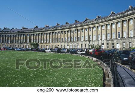Stock Image - Cars along Royal Crescent Bath UK. Fotosearch