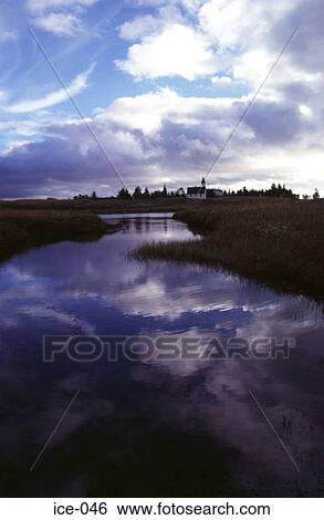 Stock Photograph - Church on a River Bank Pingvellir Iceland. Fotosearch