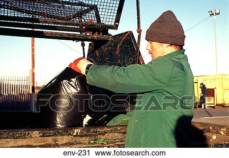 Close Up of Man Putting Rubbish Sack in Skip View Large Photo Image Stock Image - Close Up of Man Putting Rubbish Sack in Skip. Fotosearch